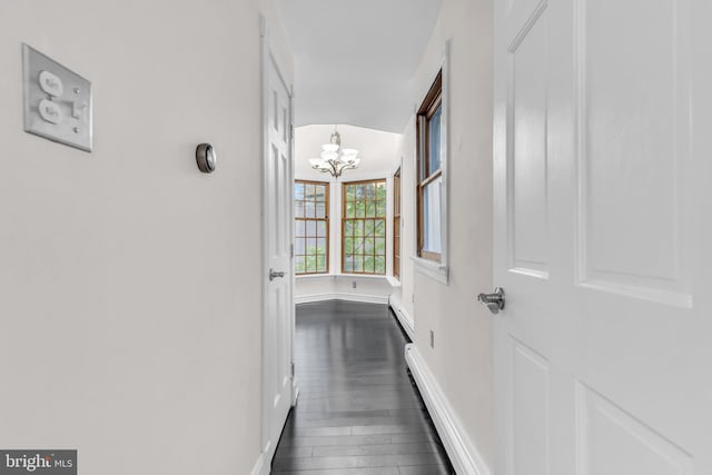 19 Center St, Barnegat, NJ 08005 - hall with a chandelier, baseboards, and dark wood-style floors