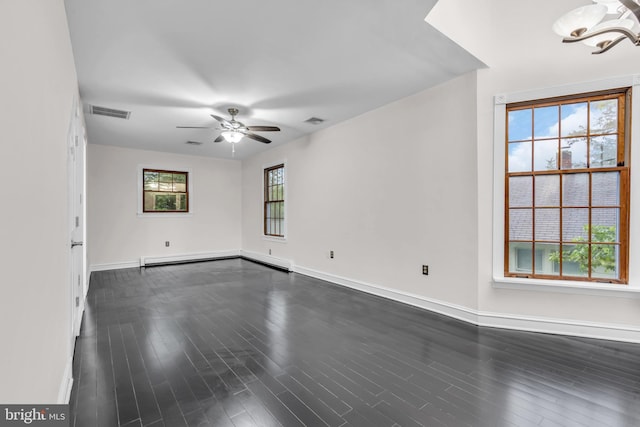 19 Center St, Barnegat, NJ 08005 - empty room with a ceiling fan, a chandelier, baseboards, dark wood finished floors, and baseboard heating