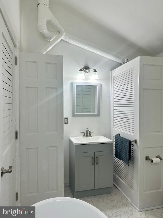 19 Center St, Barnegat, NJ 08005 - bathroom featuring vanity and lofted ceiling