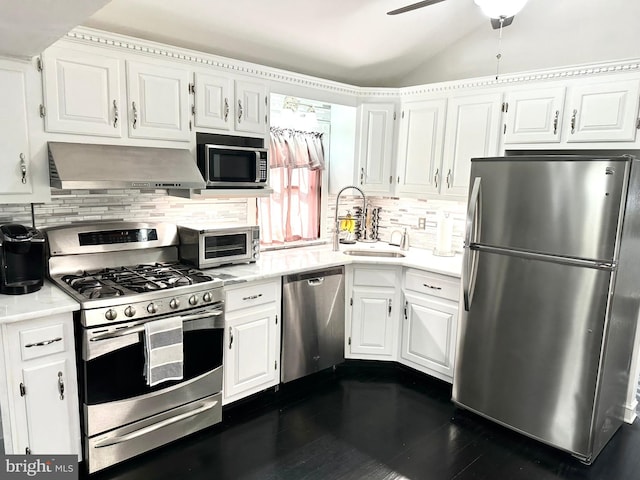 19 Center St, Barnegat, NJ 08005 - kitchen featuring appliances with stainless steel finishes, under cabinet range hood, light countertops, white cabinetry, and tasteful backsplash