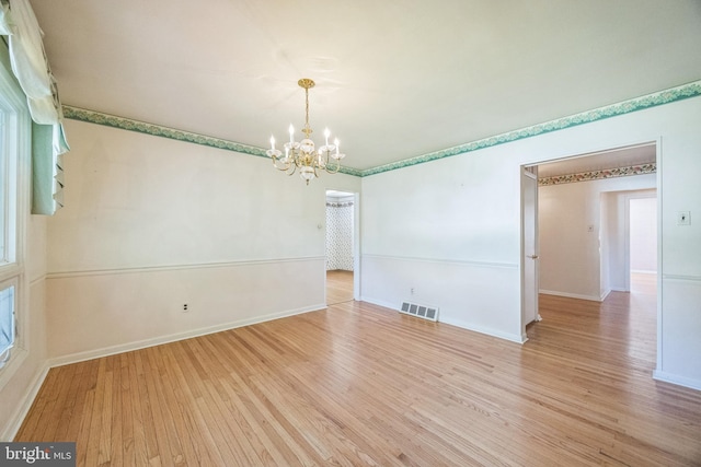 835 Wayside Ln, Haddonfield, NJ 08033 - empty room with a chandelier, wood finished floors, and baseboards