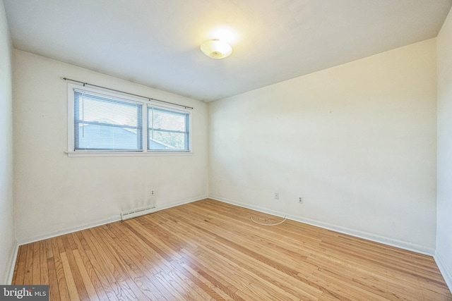 835 Wayside Ln, Haddonfield, NJ 08033 - empty room with a baseboard radiator, light wood-type flooring, and baseboards
