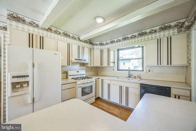 835 Wayside Ln, Haddonfield, NJ 08033 - kitchen featuring white appliances, a sink, under cabinet range hood, beam ceiling, and light countertops