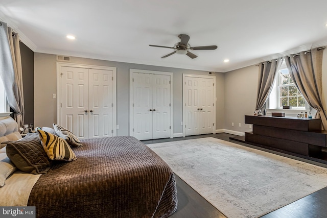 11030 Wickshire Way N, Bethesda, MD 20852 - bedroom with two closets, recessed lighting, wood finished floors, ornamental molding, and baseboards