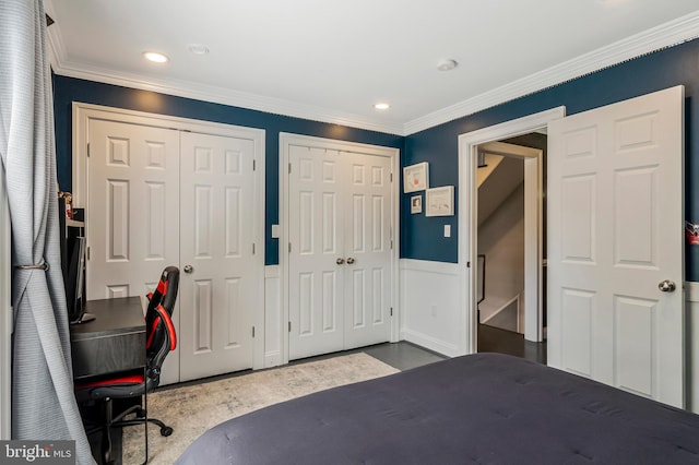 11030 Wickshire Way N, Bethesda, MD 20852 - bedroom featuring two closets, wood finished floors, crown molding, recessed lighting, and a wainscoted wall