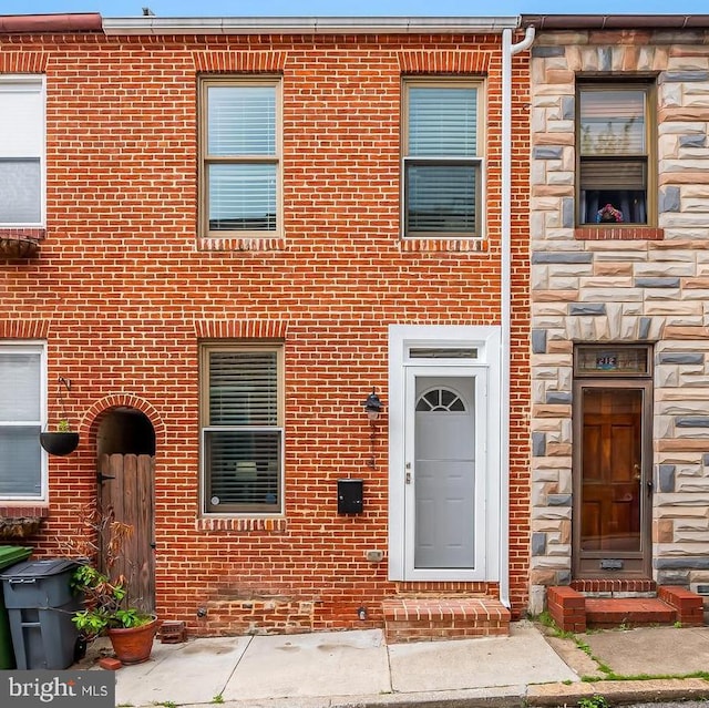 214 S Madeira St S, Baltimore, MD 21231 - view of front of house featuring stone siding and brick siding