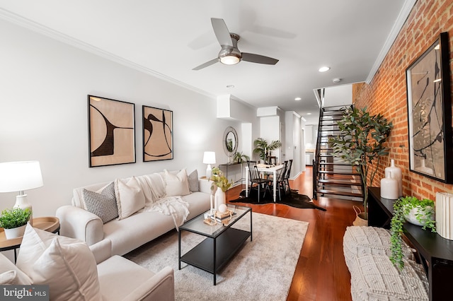 214 S Madeira St S, Baltimore, MD 21231 - living area featuring brick wall, ornamental molding, ceiling fan, wood finished floors, and stairway