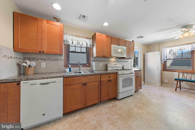 215 W 23rd St, Ship Bottom, NJ 08008 - kitchen with white appliances, a sink, plenty of natural light, decorative backsplash, and recessed lighting
