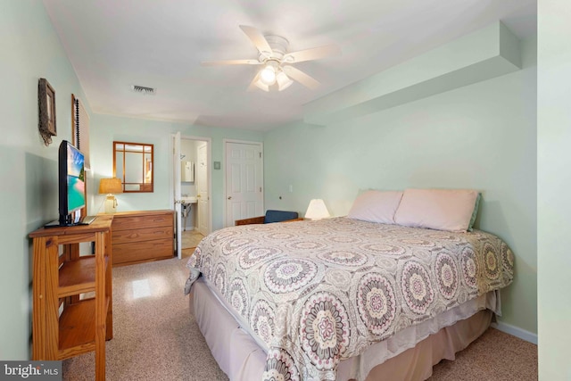 215 W 23rd St, Ship Bottom, NJ 08008 - bedroom featuring light carpet, baseboards, ceiling fan, and connected bathroom