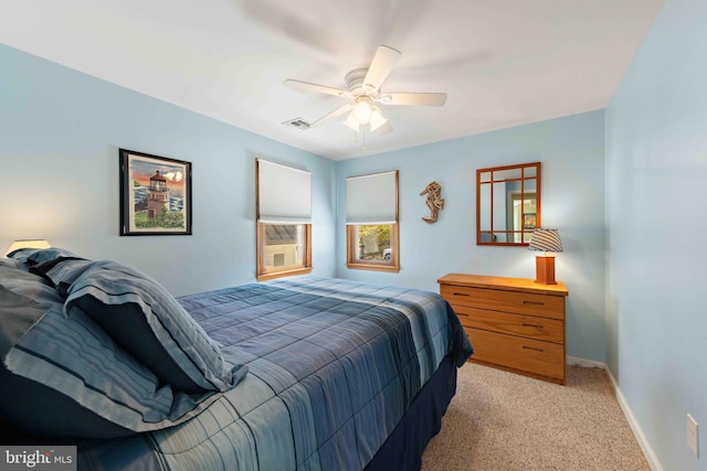 215 W 23rd St, Ship Bottom, NJ 08008 - bedroom featuring light carpet, baseboards, and a ceiling fan