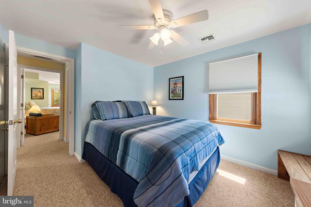 215 W 23rd St, Ship Bottom, NJ 08008 - bedroom featuring light colored carpet, baseboards, and ceiling fan