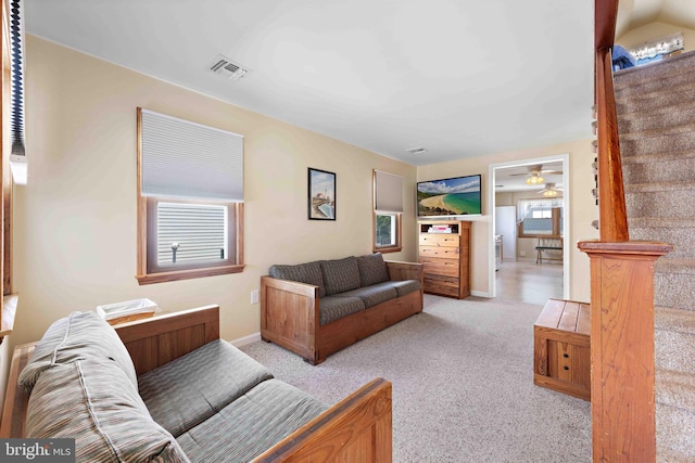 215 W 23rd St, Ship Bottom, NJ 08008 - living room with light carpet, baseboards, and ceiling fan