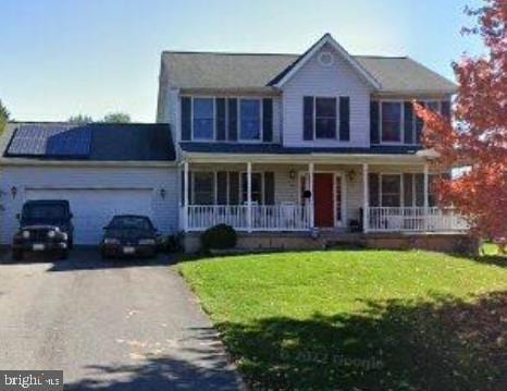 6954 Cable Dr, Marriottsville, MD 21104 - view of front of property featuring a porch, asphalt driveway, a front yard, and an attached garage