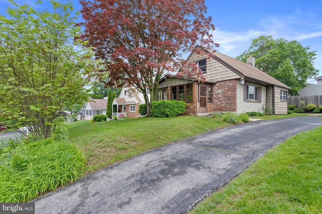1011 Woodcliffe Ave, Media, PA 19063 - view of front of house with brick siding and a chimney