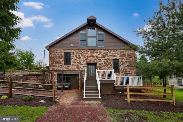 1700 N Texter Mountain Rd, Reinholds, PA 17569 - rear view of house featuring stone siding and a wooden deck