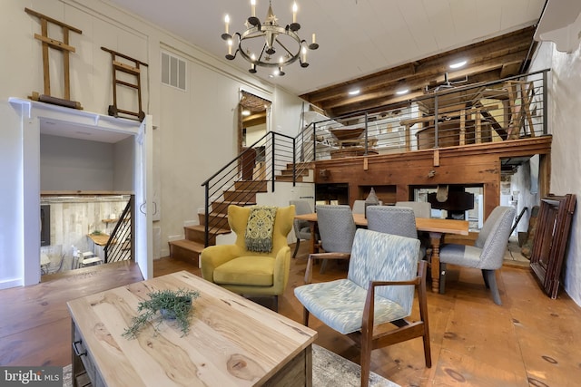 1700 N Texter Mountain Rd, Reinholds, PA 17569 - living room with stairway, a chandelier, and hardwood / wood-style floors