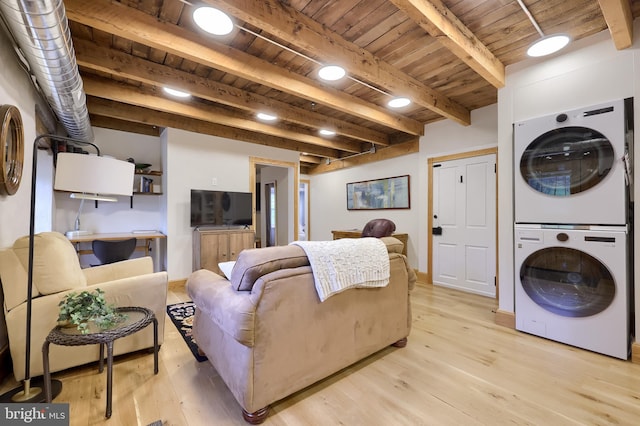 1700 N Texter Mountain Rd, Reinholds, PA 17569 - living room featuring stacked washing machine and dryer, wood ceiling with exposed beams, light wood finished floors, and baseboards