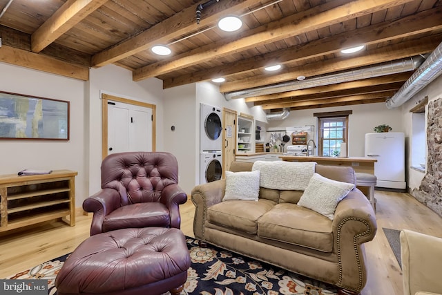 1700 N Texter Mountain Rd, Reinholds, PA 17569 - living room featuring stacked washer and clothes dryer, wooden ceiling with exposed beams, and light wood finished floors