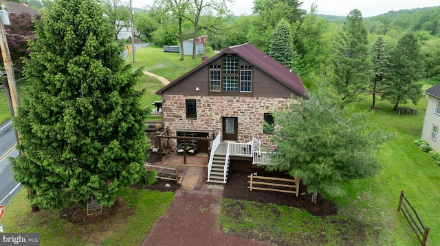 1700 N Texter Mountain Rd, Reinholds, PA 17569 - back of house featuring stone siding, a wooden deck, stairway, and a yard