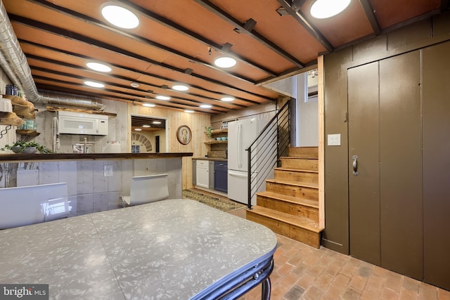 1700 N Texter Mountain Rd, Reinholds, PA 17569 - kitchen with open shelves, freestanding refrigerator, and brick flooring