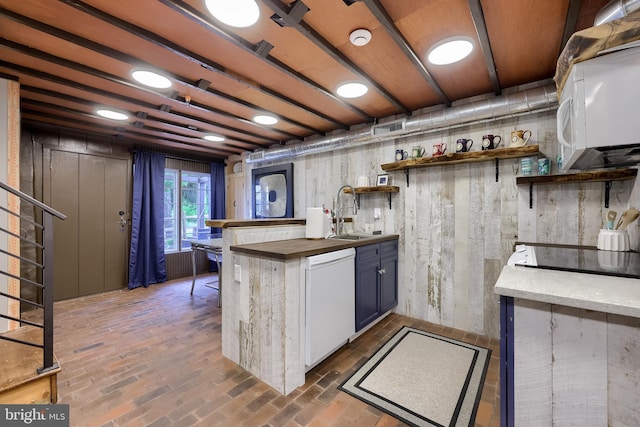 1700 N Texter Mountain Rd, Reinholds, PA 17569 - kitchen featuring white appliances, a sink, open shelves, butcher block counters, and brick flooring