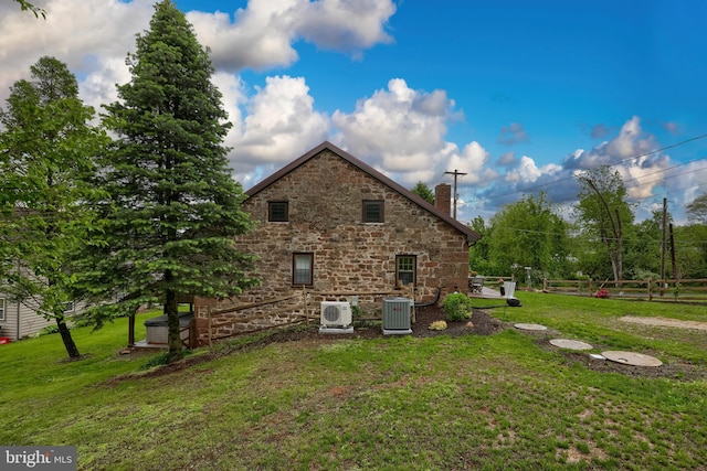 1700 N Texter Mountain Rd, Reinholds, PA 17569 - view of property exterior with stone siding, a chimney, central AC unit, and ac unit