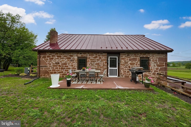 1700 N Texter Mountain Rd, Reinholds, PA 17569 - back of house with a standing seam roof, metal roof, and a chimney