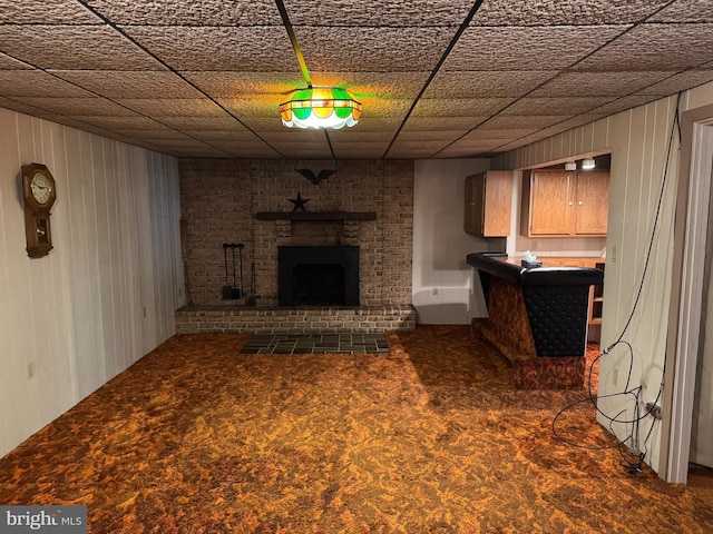 402 W Summit St, Mohnton, PA 19540 - unfurnished living room with carpet flooring, a brick fireplace, and wood walls