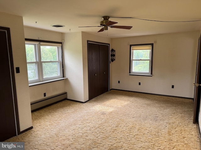 402 W Summit St, Mohnton, PA 19540 - unfurnished bedroom featuring baseboard heating, light colored carpet, baseboards, ceiling fan, and a closet