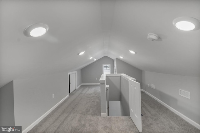 3604 White Ave, Baltimore, MD 21206 - additional living space with vaulted ceiling, light carpet, and baseboards