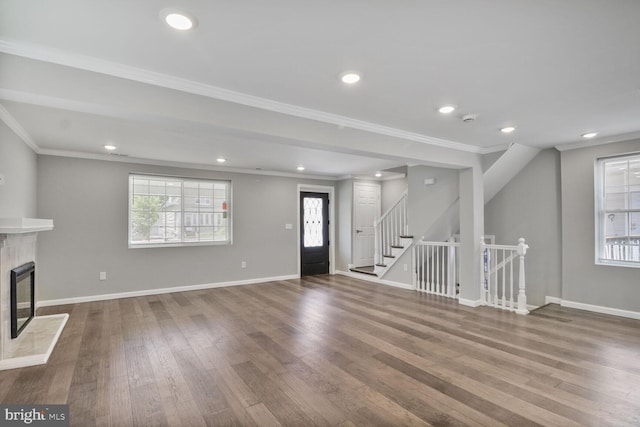 3604 White Ave, Baltimore, MD 21206 - unfurnished living room with wood finished floors, a fireplace, ornamental molding, recessed lighting, and baseboards