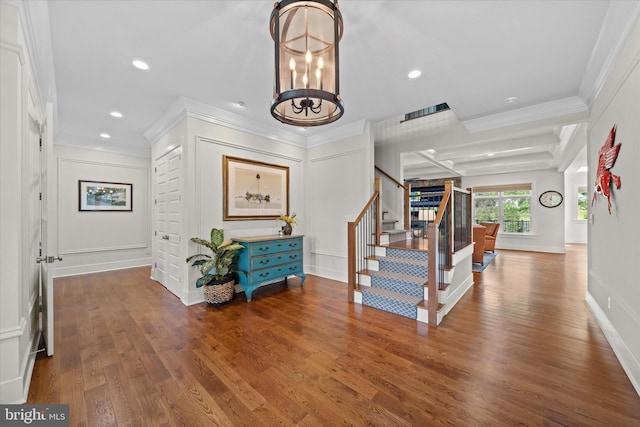 5 Raintree Rd, Chadds Ford, PA 19317 - foyer featuring ornamental molding, stairs, a chandelier, a decorative wall, and wood finished floors