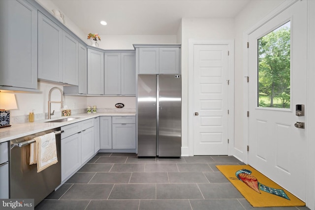 5 Raintree Rd, Chadds Ford, PA 19317 - kitchen featuring stainless steel appliances, a sink, dark tile patterned floors, gray cabinetry, and recessed lighting