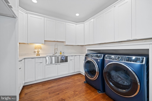5 Raintree Rd, Chadds Ford, PA 19317 - laundry room featuring washing machine and clothes dryer, cabinet space, wood finished floors, and recessed lighting