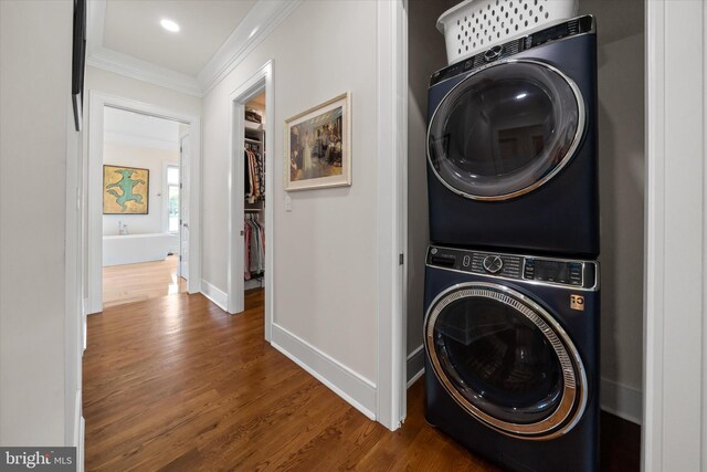 5 Raintree Rd, Chadds Ford, PA 19317 - laundry area with stacked washer and clothes dryer, ornamental molding, wood finished floors, and baseboards