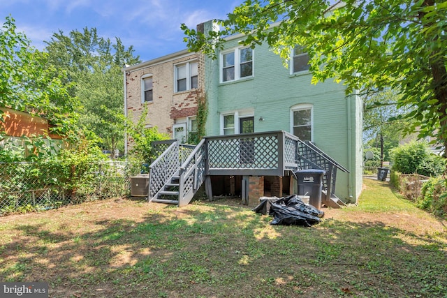 4428 Edson Pl NE, Washington, DC 20019 - back of house featuring stairway, fence, a deck, cooling unit, and brick siding