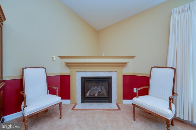 314 Valley Ct, Sinking Spring, PA 19608 - living area with vaulted ceiling, a fireplace with flush hearth, and carpet floors