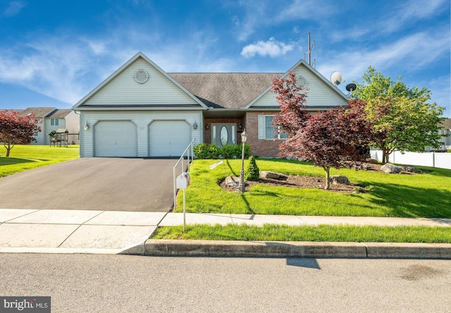 314 Valley Ct, Sinking Spring, PA 19608 - ranch-style home featuring driveway, an attached garage, a front lawn, and brick siding