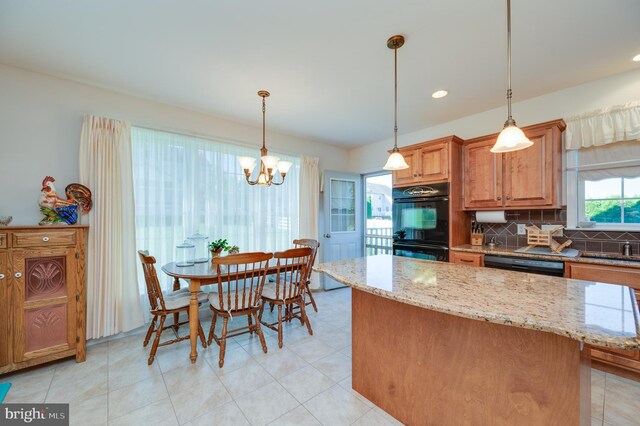 314 Valley Ct, Sinking Spring, PA 19608 - kitchen featuring black appliances, decorative backsplash, light stone countertops, pendant lighting, and recessed lighting