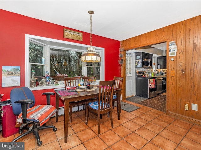 tiled dining space with wood walls