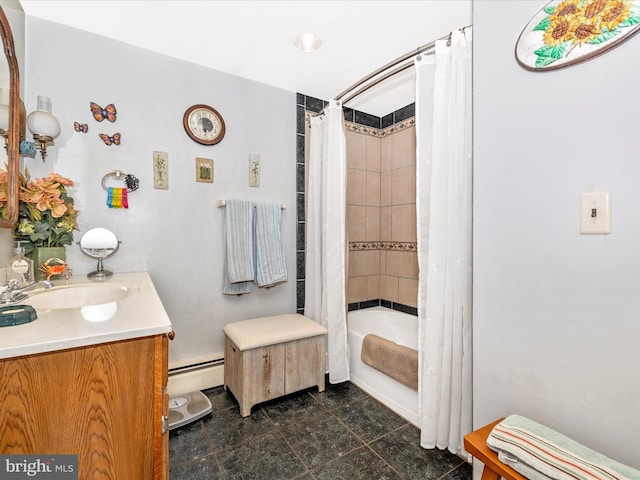 bathroom featuring a baseboard heating unit, vanity, and shower / bath combo