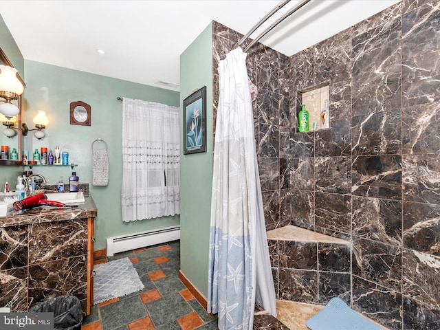 full bathroom featuring baseboard heating, a tile shower, and vanity