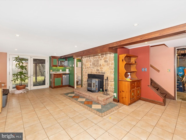 unfurnished living room featuring a wood stove, light tile patterned flooring, beamed ceiling, stairs, and recessed lighting
