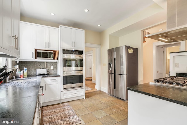 3707 Thornapple St, Chevy Chase, MD 20815 - kitchen with appliances with stainless steel finishes, ventilation hood, tasteful backsplash, white cabinets, and recessed lighting