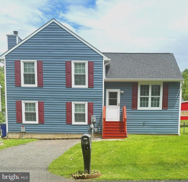 821 W Potomac St, Brunswick, MD 21716 - split level home with entry steps, a front lawn, and a chimney