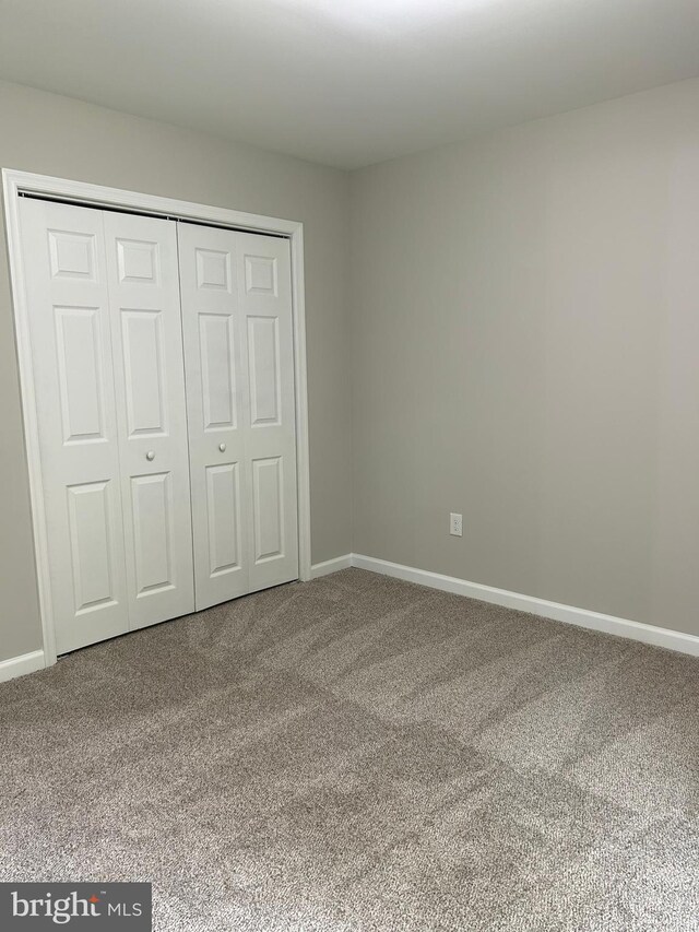 14400 Northumberland Hwy, Heathsville, VA 22473 - unfurnished bedroom featuring carpet, baseboards, and a closet