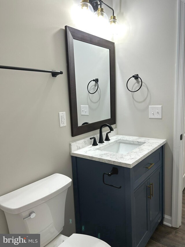 14400 Northumberland Hwy, Heathsville, VA 22473 - bathroom featuring toilet, vanity, and wood finished floors