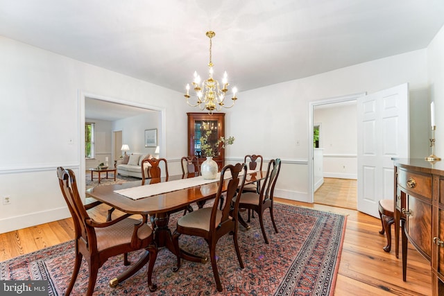 16909 Batchellors Forest Rd, Silver Spring, MD 20906 - dining room with light wood-type flooring and a chandelier