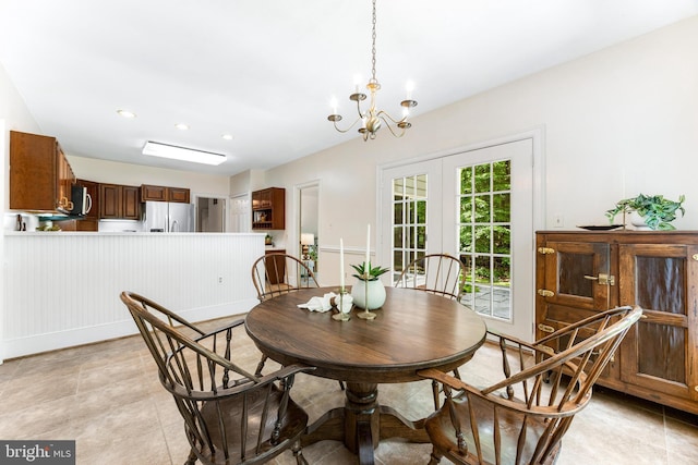 16909 Batchellors Forest Rd, Silver Spring, MD 20906 - dining area featuring a chandelier, french doors, a wainscoted wall, and recessed lighting
