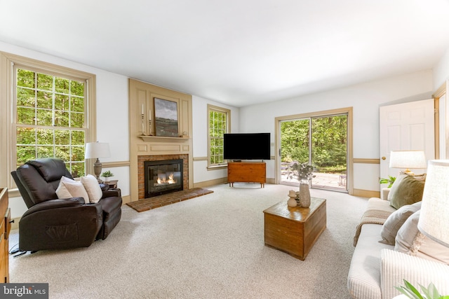 16909 Batchellors Forest Rd, Silver Spring, MD 20906 - carpeted living room featuring a brick fireplace and plenty of natural light